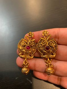 Premium quality 1Gram gold plated earrings with red ruby stone. Comes in antique finish. Goes well with any kind of ethnic wear.