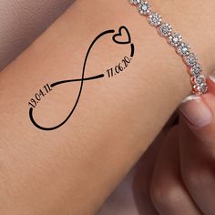 a woman's arm with an infinite love tattoo on it