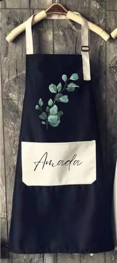 an apron hanging on a wooden wall with the word annota written in black and white