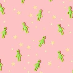 a pink background with green teddy bears and stars