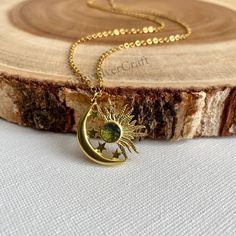 ⭐ Super delicate pendant carrying a small Moldavite stone. This special meteorite stone is a perfect gift for someone special. The dainty gold-filled complements this accessory even more. The necklace comes with a chain extender of 1 inch. ** Every stone is unique in shape, so when you place the order, I will contact you to show you the options available in the size you purchase :) ⭐Moldavite is purchased directly from a dealer in the Czech Republic, I receive one certificate of authenticity per lot. If you want to check it please contact me. ⭐MOLDAVITE PROPERTIES Moldavite is a vitreous silica rock that it was formed by a meteorite impact 15 million years ago. Moldavite has an intensely high frequency and that fact married with its cosmic collisions and its earthly and extraterrestrial vi Nickel-free Spiritual Jewelry For May Birthstone, Celestial Round Pendant Necklace For Gifts, Celestial Round Crystal Necklace For Gift, Celestial Style Round Pendant Necklace For Gift, Celestial Style Gemstone Jewelry For May Birthstone, Celestial Style Jewelry With May Birthstone, Celestial Gemstone Jewelry For May Birthstone, Celestial Style May Birthstone Gemstone Jewelry, Moon Phase Amulet Necklace Gift