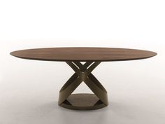 a round table with an x design on the top, and a circular wooden base