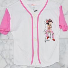 Deadstock 1996 Betty Boop Pink & White Button Up Jersey Youth M Fits Adult Xs/S White T-shirt With Button Closure For Spring, White Cotton T-shirt With Button Closure, Y2k Cotton Tops With Button Closure, Trendy White Top For Playwear, White Fitted T-shirt With Button Closure, Trendy White Top With Snap Buttons, Trendy White Top, 90s Cotton Tops With Button Closure, 90s Style Cotton Tops With Button Closure