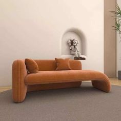 an orange couch sitting on top of a rug in front of a wall mounted clock