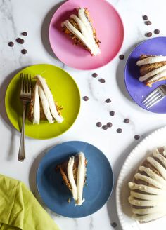 three plates with different desserts on them and one has a fork in the middle