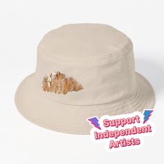 This packable, scrunchable, lightweight headwear classic is ready for adventure, from the beach to the street to the trail Breathable 100% cotton with eyelet ventilation Flat top Moderate brim is 2.2"" (5.5 cm) wide to keep the sun off your face Unstructured crown is 3.1"" (8 cm) deep Easy care: just spot clean and dry in shade. A watercolor painting of an almond croissant Almond Croissant, Hats For Sale, Flats Top, The Trail, Watercolor Painting, Bucket Hat, The Sun, The Beach, Almond