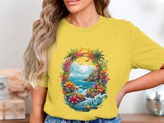 Dive into a tropical paradise with this eye-catching graphic T-shirt featuring a stunning ocean view encircled by vibrant floral elements. This shirt brings to life a picturesque scene of serene waters, lush cliffs, and abundant flowers, perfect for those who love nature and vibrant colors. Made with high-quality materials, it ensures comfort and durability for any casual occasion. Whether you're heading to the beach or just dreaming of vacation, this T-shirt is your everyday escape to paradise. Tropical Paradise Beach, Sunset Backdrop, Tropical Sunset, Birthday Fashion, Tree Graphic, Golden Sun, Beach T Shirts, Product Feature, Beach Lovers