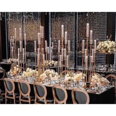 a long table is set with candles and flowers