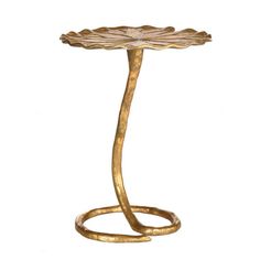 a brass table with a leaf design on it's base and a metal ring around the edge