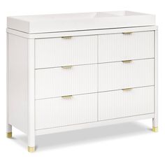 a white dresser with gold handles and drawers on the bottom, against a white background