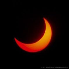 the moon is seen during a partial solar eclipse in this photo taken on july 29, 2012