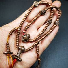 ❤This mala was collect from Hepo Town Baiyu County Tibet, blessed in Yaqing Monastry.It is made of copper,brown color,length is 44cm / 18",has 1 Kartika ,2 skeletons, 2 stamp pendant, and 2 strings of counters with phurba + kartika.❤DETIALS100% HandmadeMaterial:red copperSize:Mala'perimeter is 44cm,18 inches.108 bodhi beads: 5mm ,about 0.2"1 kartika:2.7cm ,about 1.1"2 skull beads:1.1cm * 1.1cm ,about 0.43" * 0.43"2 counters: 6cm long, about 2.36"❤ Great Mala For Meditation and Yoga Practitioners Adjustable Copper Spiritual Necklaces, Spiritual Adjustable Copper Necklace, Bronze Spiritual Necklaces For Festivals, Spiritual Bronze Necklaces For Festivals, Traditional Brown Jewelry For Blessing, Bronze Spiritual Necklaces For Rituals, Brown Necklace With 108 Beads For Festivals, Spiritual Copper Necklace For Meditation, Brown Amulet Necklace With 108 Beads