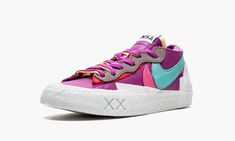 The Kaws x Sacai x Nike Blazer Low “Purple Dusk” is a three-way collaboration between the Brooklyn-based artist, the high fashion brand, and Nike on the retro basketball shoe.  A December 2021 release, the “Purple Dusk” is one of several colorways of the Blazer Low co-created by Kaws and Sacai in Fall 2021.  Sacai and Nike have also collaborated with Fragment and Undercover on various shoes in 2021, in addition to multiple forays with Kaws on the Blazer, as well.  The upper features a Purple Dus Kaws Purple, Nike Blazer Low, High Fashion Branding, Retro Basketball Shoes, Retro Basketball, Blazer Low, Nike Blazer, Colored Leather, Gray Suede