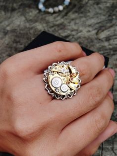 Adjustable steampunk ring made from a vintage swiss watch movement. Handmade. It looks very unusual on the finger. Ring size - adjustable Insert diameter - 19 мм (0,7 inch) I will ship the ring very quickly after purchase, as I am interested in you receiving your item as quickly as possible. Usually delivery takes 10-20 days, but there are delays. Please consider this before purchasing. If you have any questions, please write to me, I will be happy to answer you. There are many different vintage items in my store, please take a look, maybe you will find what you have been looking for for a long time. https://www.etsy.com/shop/ShopUSSRGoods?ref=seller-platform-mcnav Best regards, Maks Steampunk Rings, Style Steampunk, Vintage Watches Women, Swiss Watch, Steampunk Style, Watch Vintage, Steampunk Jewelry, Watch Gifts, Women Wrist Watch