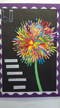 a bulletin board with colorful paper flowers on it