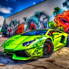 a green sports car parked in front of a graffiti covered wall