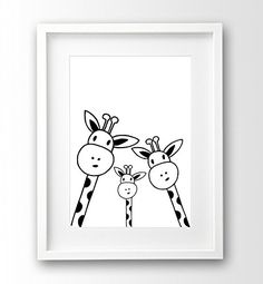 two giraffes standing next to each other in a white frame on a wall