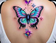 a woman's back with a colorful butterfly tattoo on it