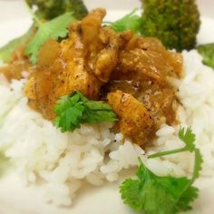 a plate with rice, broccoli and chicken on it is shown in this image