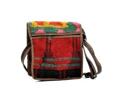 "1980s Beautiful crossbody bagTurkish vintage deadstock * Colorful woven tapestry * Adjustable crossbody strap * Front flap with velcro * Top zipper closure * Back zipper pocket BRAND: No brand ORIGIN: Made in Turkey MATERIAL: Traditional woven tapestry, not sure if it's genuine or synthetic leather. CONDITION: Great Condition (new, never used, vintage old stock, originally from the 1980s) MEASUREMENTS (measured flat) Height: 10\" Width: 10\" Deep: 3.25\" Strap: Approx. up to 56\" long, 1\" wide Vintage Square Satchel With Adjustable Strap, Vintage Handmade Satchel For Travel, Handmade Vintage Rectangular Shoulder Bag, Vintage Handmade Shoulder Bag For Travel, Handmade Vintage Square Shoulder Bag, Vintage Handmade Square Shoulder Bag, Vintage Handmade Rectangular Shoulder Bag, Vintage Handmade Crossbody Bag, Vintage Multicolor Shoulder Bag For Travel