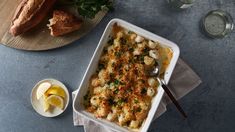 a casserole dish with meat and vegetables in it