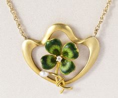 "This fabulous Antique Green Shamrock Necklace has a lovely natural seed pearl, diamond and stunning enamel work. The gold has a beautiful brushed finish. This is truly an amazing and one-of-a-kind piece of jewelry and piece of art. The necklace is even adorned with a gorgeous antique clasp. Antique Four Leaf Clover Necklace 1890's Green Enamel Diamond Natural Seed Pearl 14k Yellow Gold Pendant Size: 1\" by 1\" Necklace Length: 20\" Please read our shop policies prior to purchase. Thanks for loo Victorian Enamel Yellow Gold Necklace, Victorian Yellow Gold Enamel Necklace, Victorian Style Yellow Gold Enamel Necklace, Antique Yellow Gold Enamel Necklace, Gold Art Deco Necklace With Pearl Pendant, Gold Enamel Art Nouveau Jewelry, Yellow Gold Enamel Necklace For Wedding, Collectible Art Nouveau Yellow Gold Jewelry, Art Nouveau Gold Enamel Jewelry