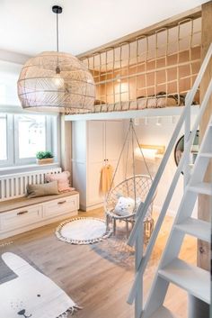 there is a loft bed in the middle of this room with stairs to the second floor