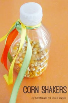 corn shakers in a glass jar with ribbon