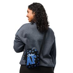 Carry your essentials with pride in the "Collegiate Sober AF Crossbody Bag." Drawing inspiration from the bold, collegiate-style 'Sober AF' design, this bag makes a proud statement in any setting. The classic varsity lettering paired with a sleek, black background creates a striking contrast that's both stylish and assertive. Constructed from 100% polyester, the bag is resilient and water-resistant, just like the commitment it represents. It's equipped with adjustable straps, inside and outside pockets, and a two-way zipper, making it the perfect accessory for anyone who is Sober AF and proud. • 100% polyester • Fabric weight: 9.91 oz./yd.² (336 g/m²) • Bag size: 5.7″ × 7.7″ × 2″ (14.5 cm × 19.5 cm × 5 cm) • Water-resistant and durable • Sturdy fabric with fusible backing to add firmness • Bag Drawing, Collegiate Style, Varsity Letter, Drawing Inspiration, Black Background, Black Backgrounds, Fabric Weights, Polyester Fabric, Adjustable Straps