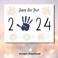 a happy new year card with a hand print on it and fireworks in the background