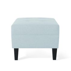 a light blue ottoman with black legs