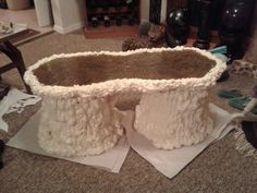 there is a very large cake that looks like it has been made out of sheep's wool