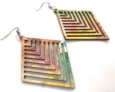 Bold statement earrings that are made of lightweight wood in a geometric cut. These have been painted with a mix of watercolor shades, so they have an abstract and colorful look. Since these are hand-painted, no two pieces are exactly the same. Both the front and backs have color, and each side has treated given a semigloss protective coat. These are on the larger side, but they are lightweight and comfortable enough to wear all day. They dangle below the earlobe approximately 8 cm, and the earr Unique Dangle Earrings, Christmas Gift Jewelry, Wood Earrings, Boho Look, Woman Painting, Painted Wood, Turquoise Jewelry, Earring Gifts, Statement Jewelry