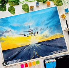 an airplane is taking off from the runway with colorful paint and marker markers on it