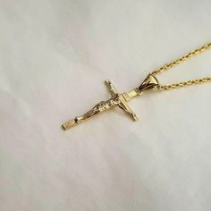 men's and women's crucifix cross necklace pendant 1 M 27mm made in real 14k solid gold or real 18k solid gold jesus with exquisite details is on the cross that has a wooden texture. - this crucifix pendant height is M 27.0mm. - the crucifix necklace pendant 1 23mm, 27mm, 30mm, and 40mm are on our store. - materials: real 14k solid gold, real 18k solid gold - model wears a 14k 1.7mm 50cm chain. - free shipping on all orders via fedex - designed by carre d'or - made in South Korea 14k gold cross pendant necklace weight pendant only 1.92g (±3%) with 1.4mm 42cm chain 4.78g (±3%) with 1.7mm 42cm chain 6.00g (±3%) with 2.1mm 42cm chain 7.88g (±3%) 18k gold cross pendant necklace weight pendant only 2.29g (±3%) with 1.4mm 42cm chain 5.49g (±3%) with 1.7mm 42cm chain 6.67g (±3%) with 2.1mm 42cm ch Yellow Gold Crucifix Necklace Tarnish Resistant, Yellow Gold Tarnish-resistant Crucifix Necklace, Tarnish Resistant Yellow Gold Crucifix Necklace, Cross Necklace Women, Crucifix Necklace, Wooden Texture, Gold Cross Necklace, Gold Cross Pendant, Gold Models