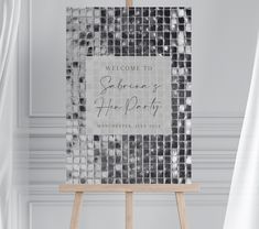 an easel with a sign that reads welcome to someone's home party