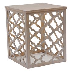 the side table is made out of wood and has an intricate design on it's sides