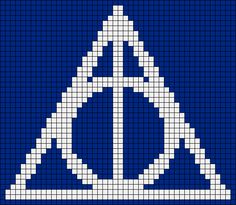 a blue and white cross stitched pattern with an inverted triangle