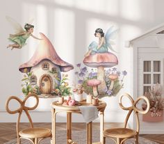 a room with fairy wallpapers and furniture in the corner, including a small table and chairs