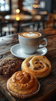 a cup of coffee and some pastries on a table