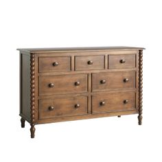 a wooden dresser with many drawers and knobs on it's sides, against a white background