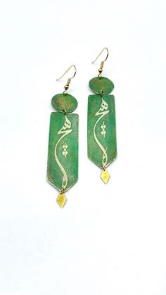 "brass earrings, limited edition  A word from Masterpiece poetry from Molana. Heech: Nothing (The utmost state of purification from all the layers of one's identity, the highest state of love when the lover has completely dissolved in the beloved, annihilated), green color is fixed. Size: 2 5/8\" X 5/8\" and very lightweight" Traditional Green Brass Earrings, Artisan Green Brass Earrings, Green Brass Earrings As Gift, Green Brass Earrings For Gift, Gold Earrings With Patina As A Gift, Gold Earrings With Patina For Gift, Artisan Brass Earrings With Patina, Artisan Earrings With Patina As Gift, Artisan Patina Earrings As A Gift