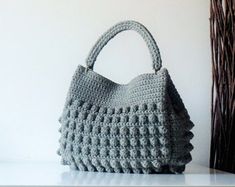 a crocheted purse sitting on top of a table