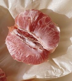 the blood oranges have been peeled and are still in their wrapper on the table