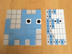 two pieces of blue and white paper with numbers on them sitting next to each other