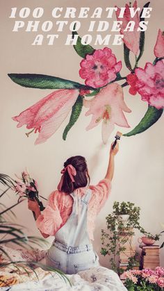 a woman painting flowers on the wall with text overlay that reads, 100 creative photo ideas at home