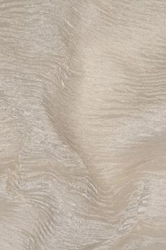 an image of a textured wallpaper with white and beige colors in the background