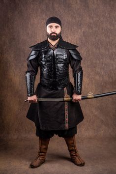 Embody the spirit of Osman Ghazi with this handcrafted leather costume armor set! This professional-grade armor, meticulously crafted from high-quality cowhide, is perfect for historical reenactments, LARP events, cosplay, or simply showcasing your Turkish warrior spirit. Features:     Handcrafted Quality: Every detail is hand-stitched, replicating traditional production methods for an authentic look and feel.     Durable Leather: Made from genuine cow leather, this armor is built to withstand t Arabian Armor, Middle Eastern Armor, Greek Leather Armor, Viking Leather Armor, Ottoman Armour, Persian Warrior, Costume Armour, Larp Armor, Historical Reenactment