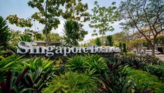 the sign for singapore gardens in front of some trees