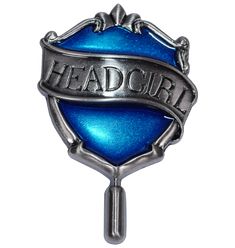 a blue and silver badge with the word head boy on it's front end